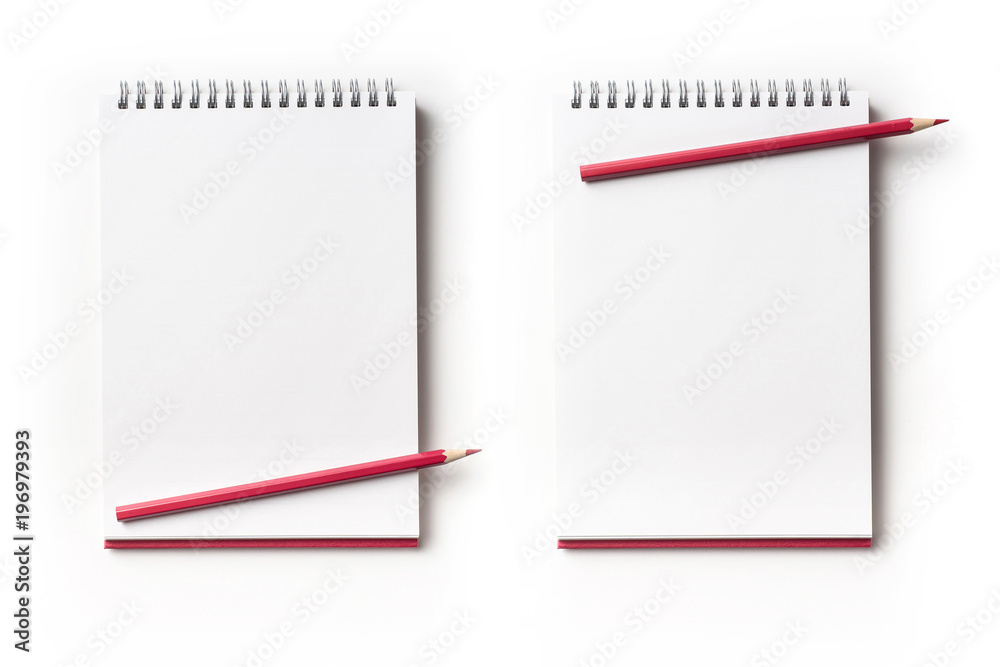 Design concept - Top view of red spiral notebook and color pencil collection isolated on white background for mockup Design concept - Top view of red spiral notebook and color pencil collection isolated on white background for mockup