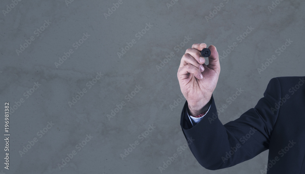Fototapeta premium businessman with pen drawing on the wall