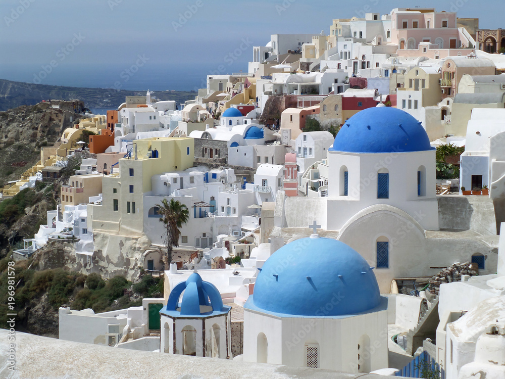 White and blue Greek Islands style architecture of Oia village, Santorini island, Greece 