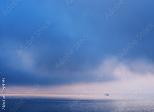 Calm sea and heavy clouds in the sky. © volff