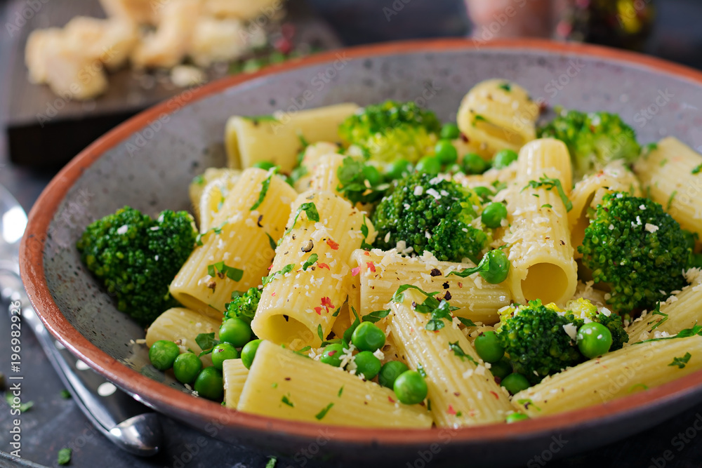 Pasta rigatoni with broccoli and green peas. Vegan menu. Dietary food Pasta rigatoni with broccoli and green peas. Vegan menu. Dietary food