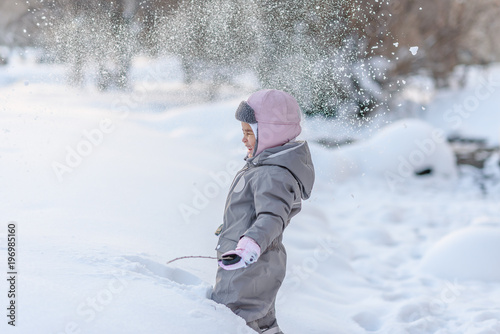 Cute child playingCute child playing with snow with snow
