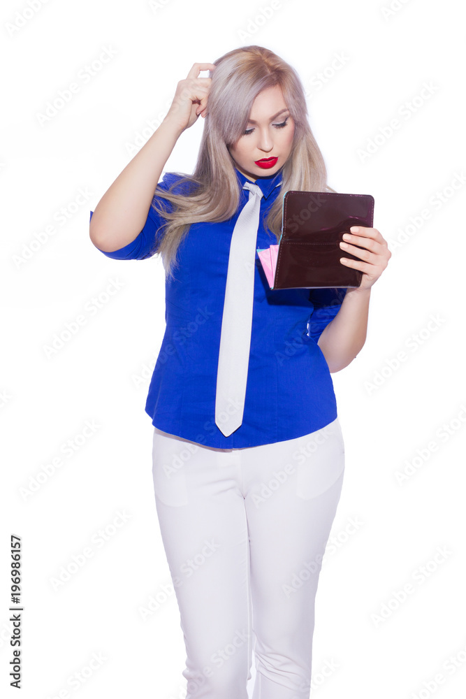 studio isolated portrait of a young blond woman in white trouser suit. The girl is holding a purse. studio isolated portrait of a young blond woman in white trouser suit. The girl is holding a purse.