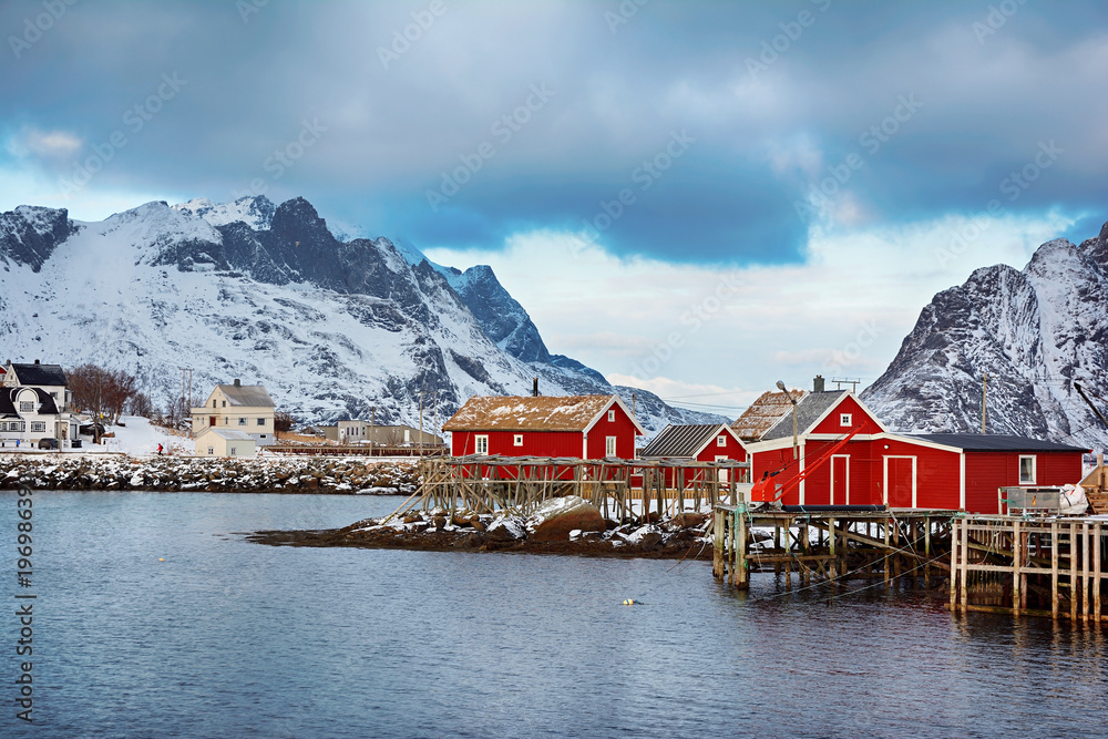 Beautiful winter landscape of picturesque fishing village with red rorbu in the Lofoten islands
