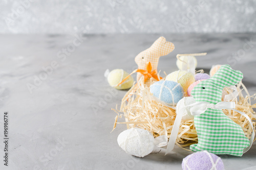 Fototapeta Naklejka Na Ścianę i Meble -  Easter composition with bunnies, eggs and tulips.