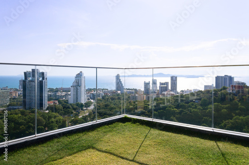 Thailand aerial high view point from Pattaya Unixx condo: park, ocean beach and condominiums. Relax background for meditations. Downtown with blue clear sky. Sunny day