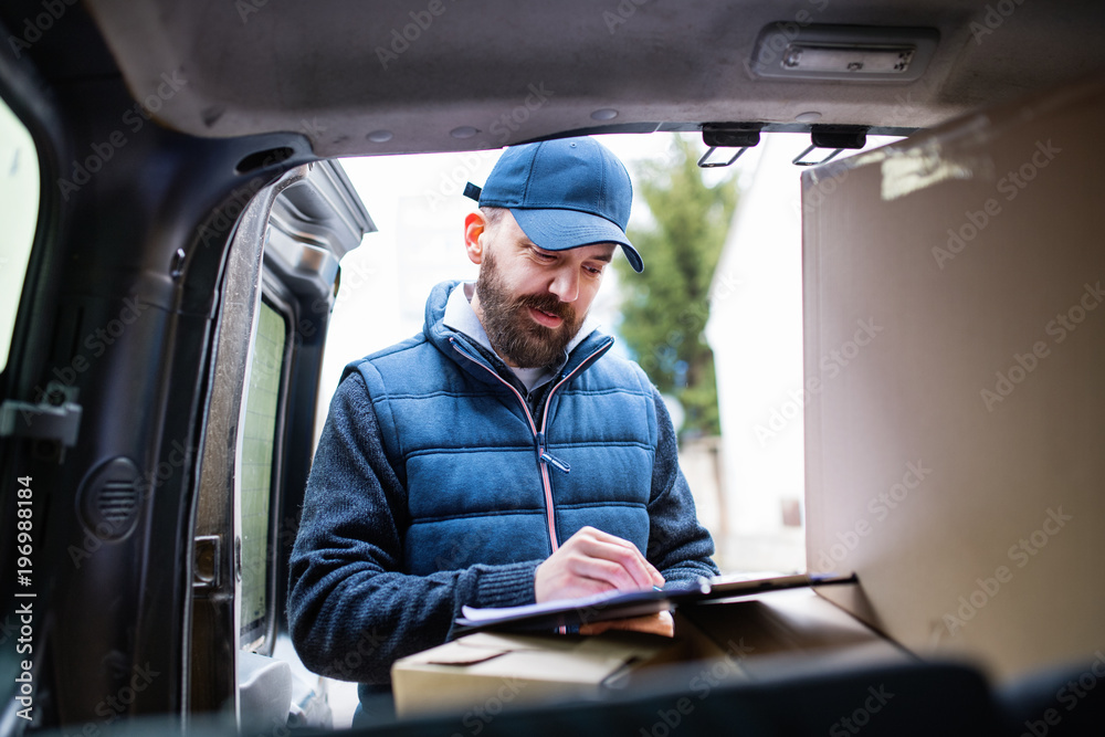 Delivery man delivering parcel box to recipient. Delivery man delivering parcel box to recipient.