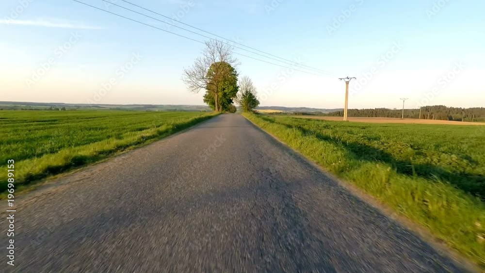 Car driving in spring time in rural countryside Car driving in spring time in rural countryside