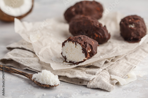 Billede på lærred Raw homemade vegan chocolate coconut candy bounty, white background