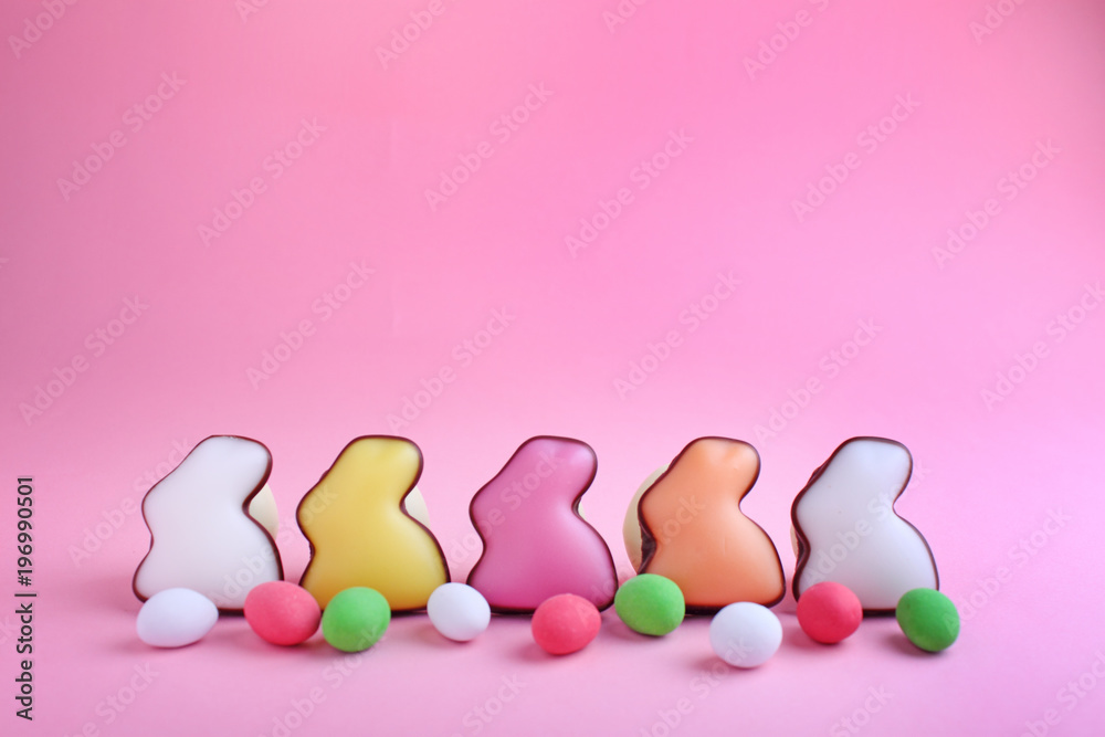 Sweets for celebrate Easter. Candies in shape of easter bunny and chocolate egg.