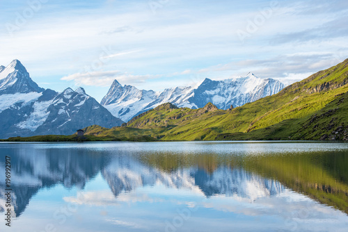 A magical landscape with a lake in the mountains in the Swiss Alps, Europe. Wetterhorn, Schreckhorn, Finsteraarhorn et Bachsee. ( relaxation, harmony, anti-stress - concept).