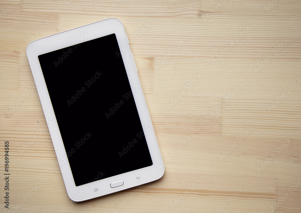 wooden table top view tablet photo shot