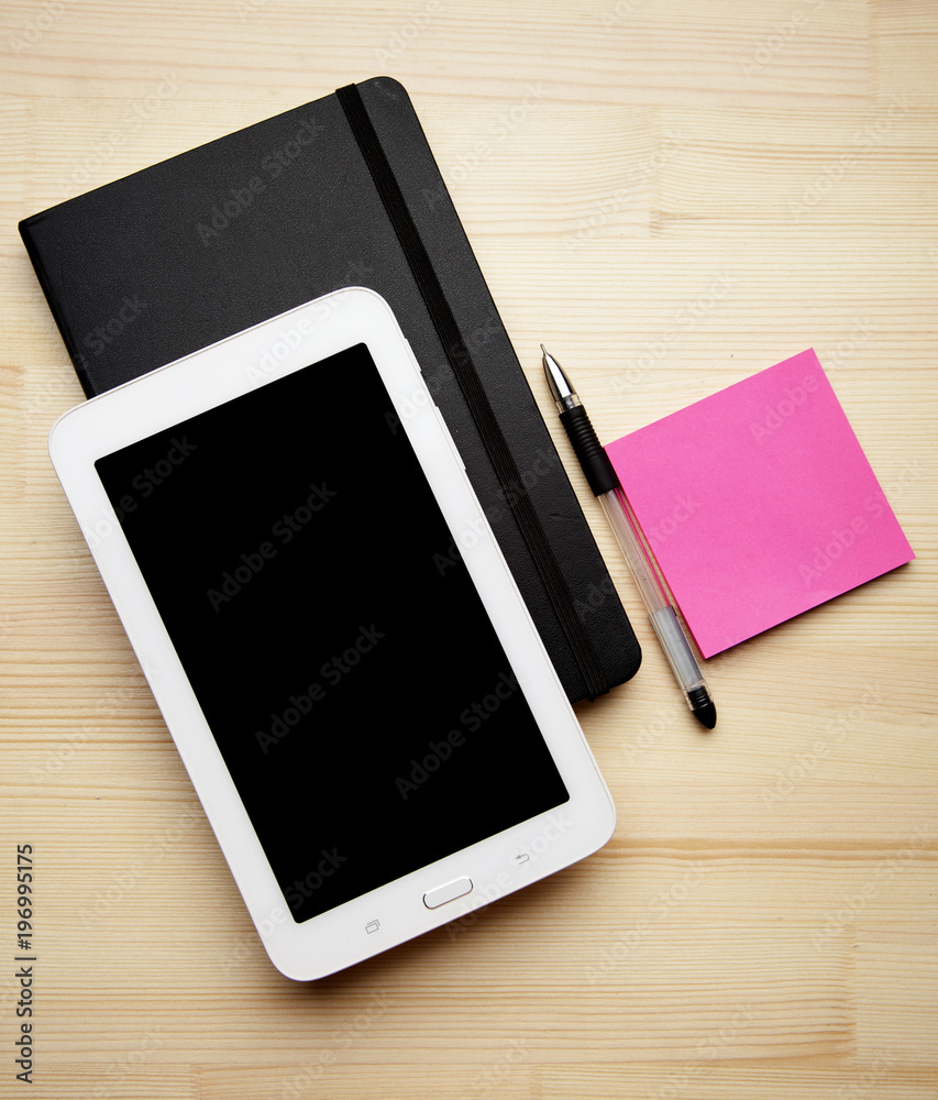 photo top view wooden table tablet note pen