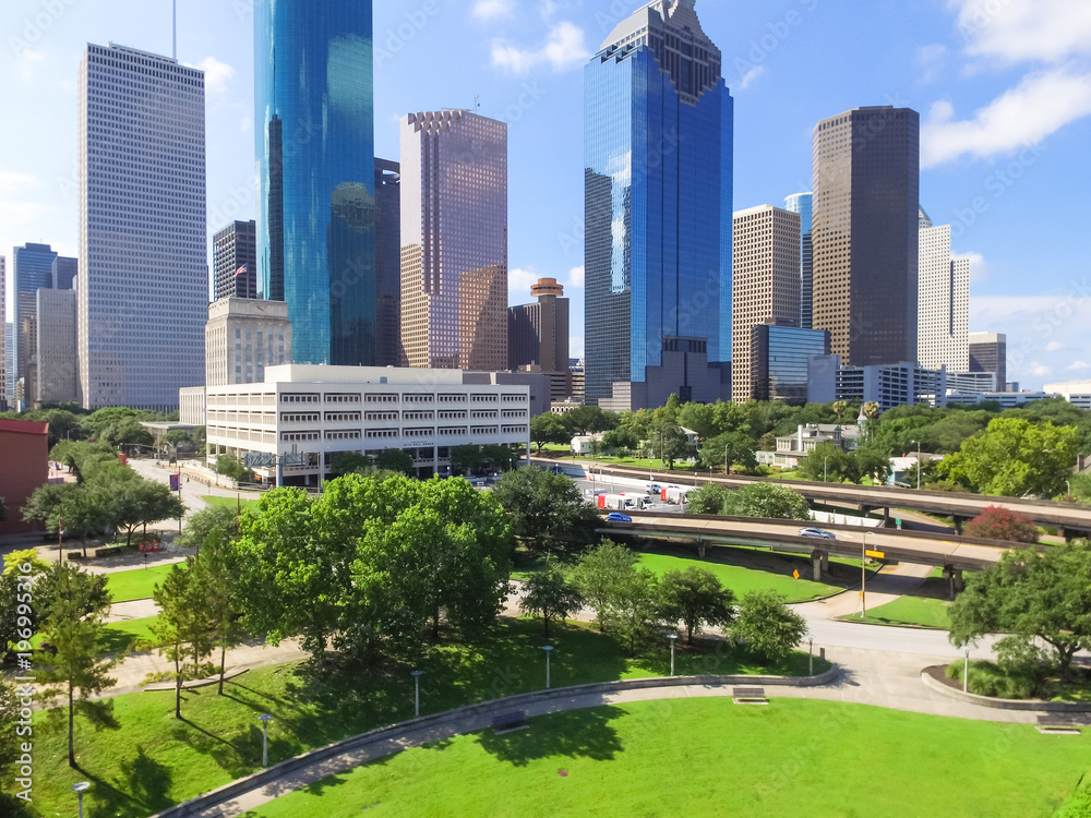 Fototapeta premium Aerial view Houston downtown and Gulf Freeway (highway I45). Daytime cityscape with cloud blue sky.