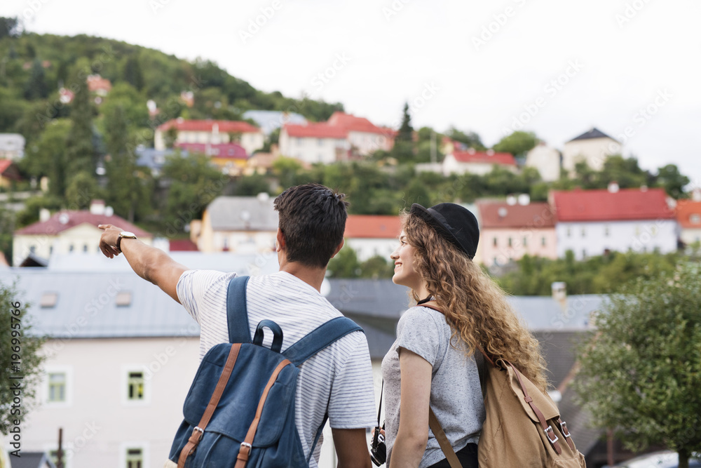 Fototapeta premium Two young tourists with camera in the old town.