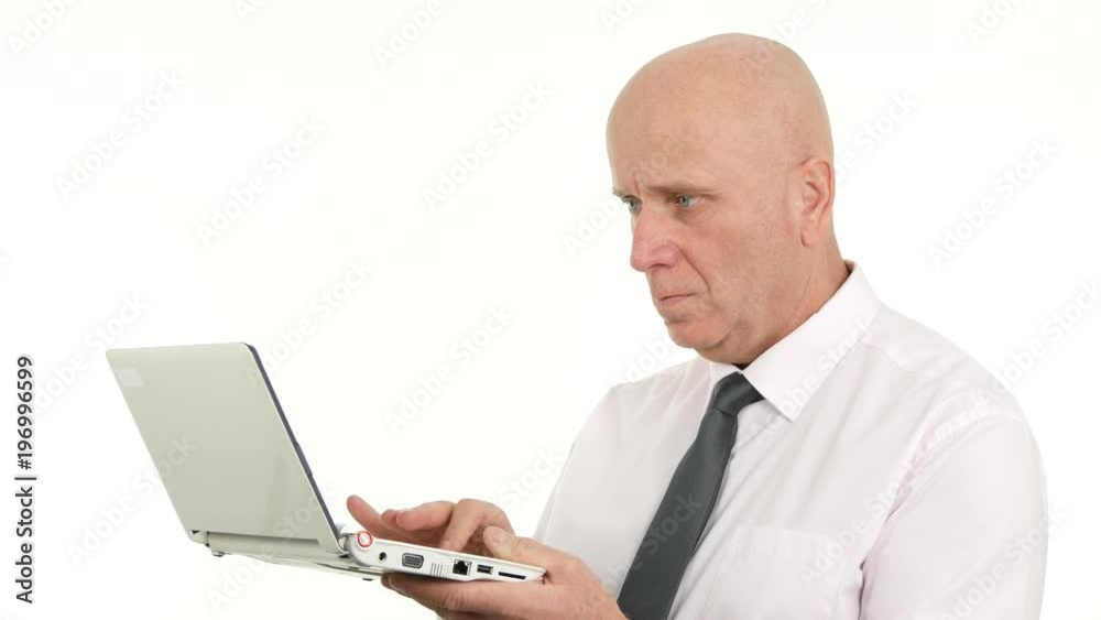 Businessman Working Hard Using a Laptop Read Information and Thinking Pensive Businessman Working Hard Using a Laptop Read Information and Thinking Pensive
