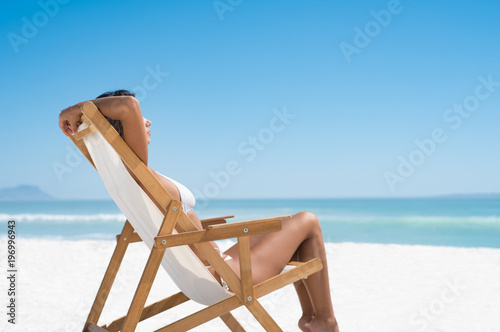 Woman sunbathing at beach