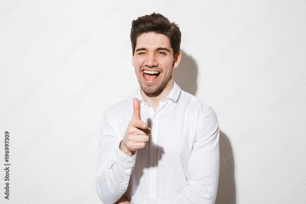 Portrait of a happy young man dressed in shirt