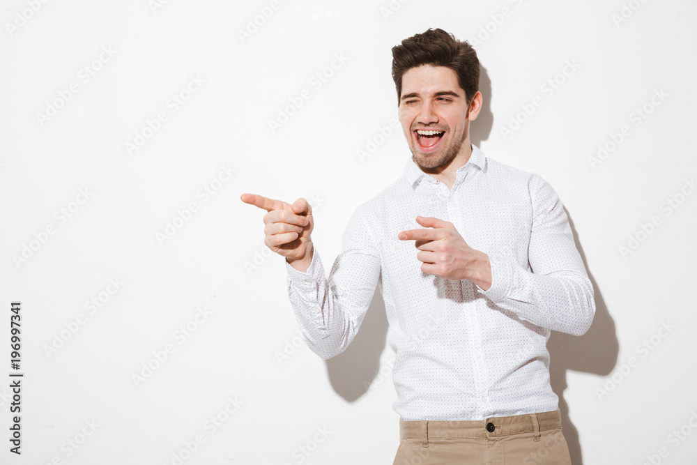 Portrait of an excited young man dressed in shirt Portrait of an excited young man dressed in shirt
