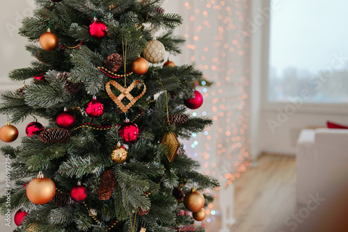 Decorated Christmas tree on blurred  sparkling and fairy background
