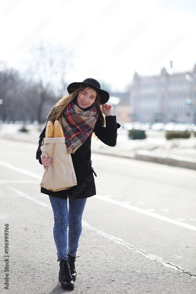 French woman with baguettes in the bag French woman with baguettes in the bag