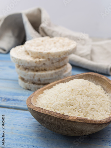 original rice cakes with rice on a blue wooden background.  