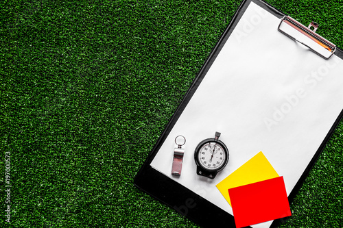 Fototapeta Naklejka Na Ścianę i Meble -  concept refereeing sport on green background top view mock up
