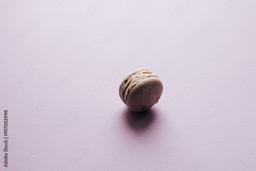 Delicious macaroon on purple table, sweet dessert Delicious macaroon on purple table, sweet dessert