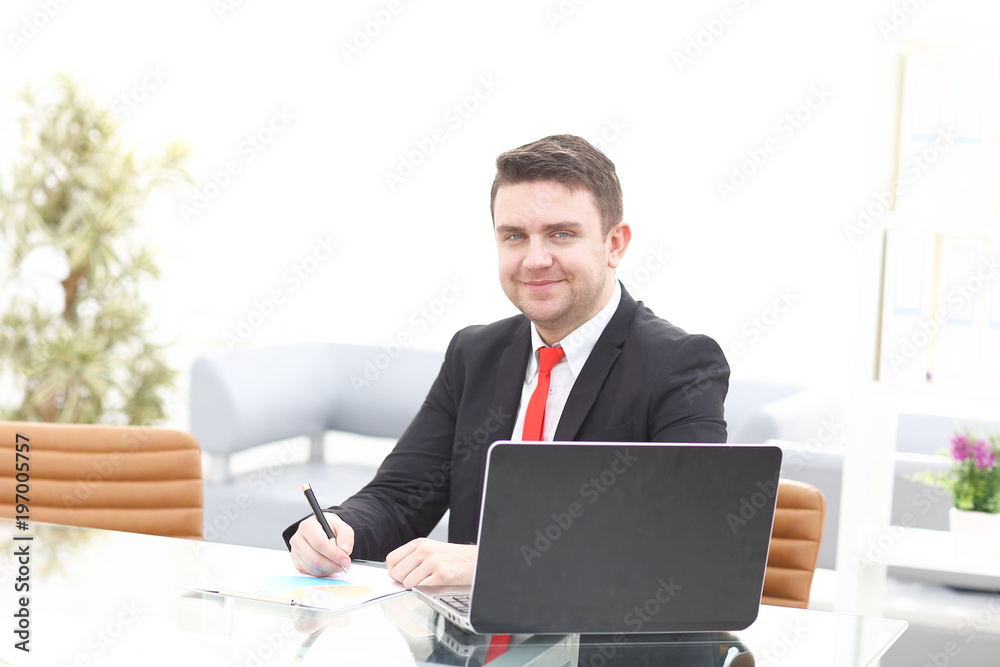 Elegant businessman analyzing data in office Elegant businessman analyzing data in office