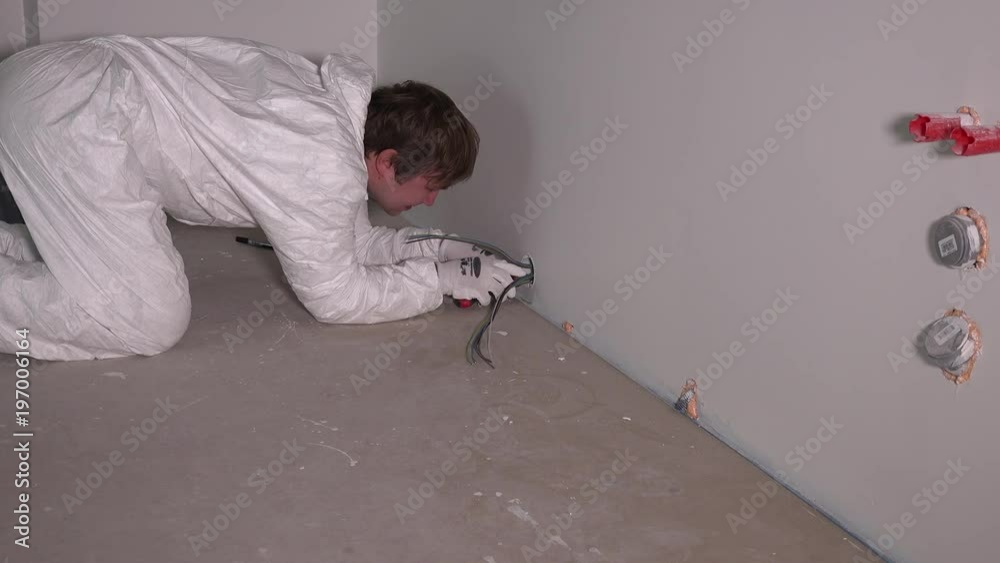male electrician worker hands at wiring cable or wall outlet socket installation male electrician worker hands at wiring cable or wall outlet socket installation