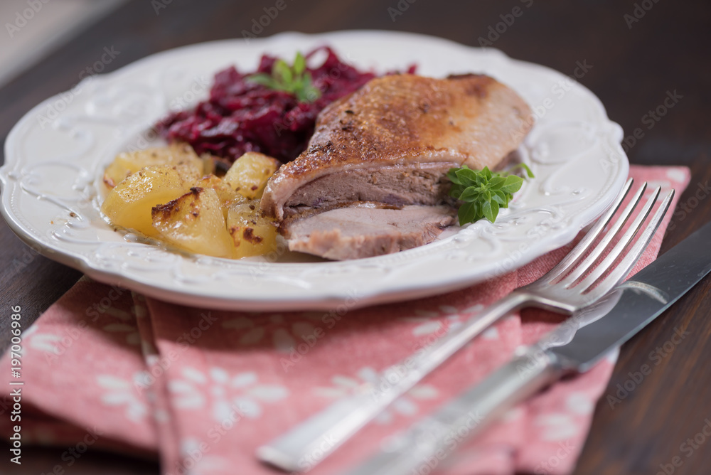Duck meat with potatoes and braised blue cabbage with raspberries. Duck meat with potatoes and braised blue cabbage with raspberries.