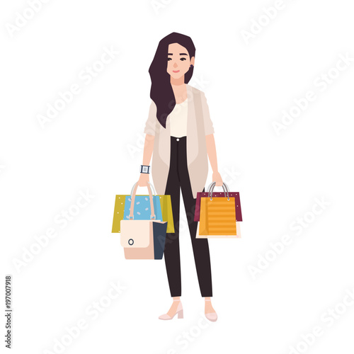 Young smiling brunette woman dressed in casual clothing holding shopping bags isolated on white background