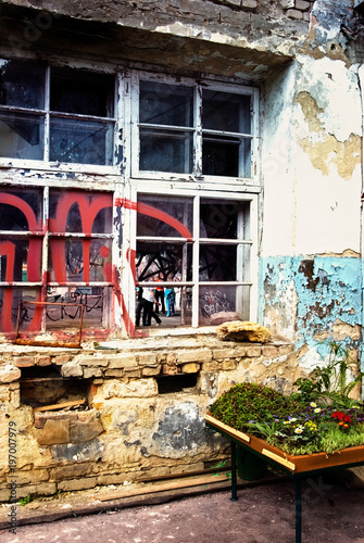 Abandoned house exterior covered with graffiti