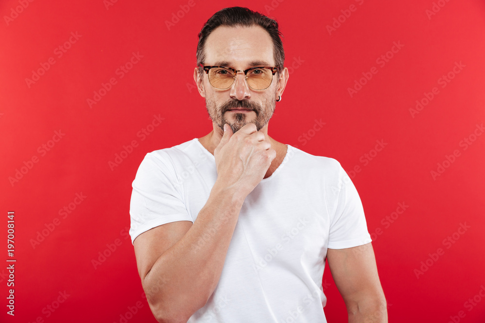 Adult serious man in colorful sunglasses Adult serious man in colorful sunglasses