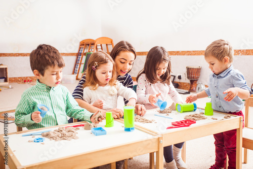 Children play with kinetic sand