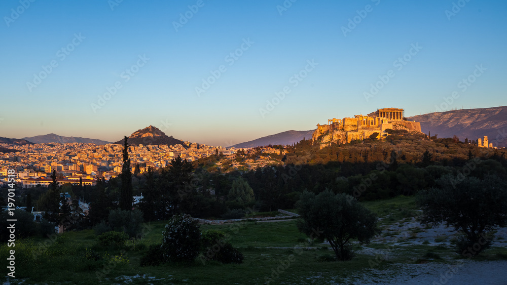The Parthenon Temple at the Acropolis of Athens during colorful sunset, Greece
