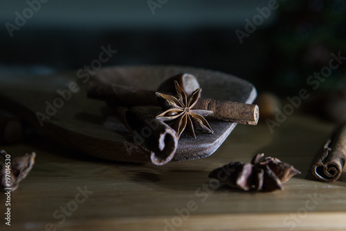 Star Anise and other Ingredients In a Wooden Spoon