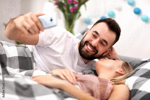 Adult attractive couple in bed