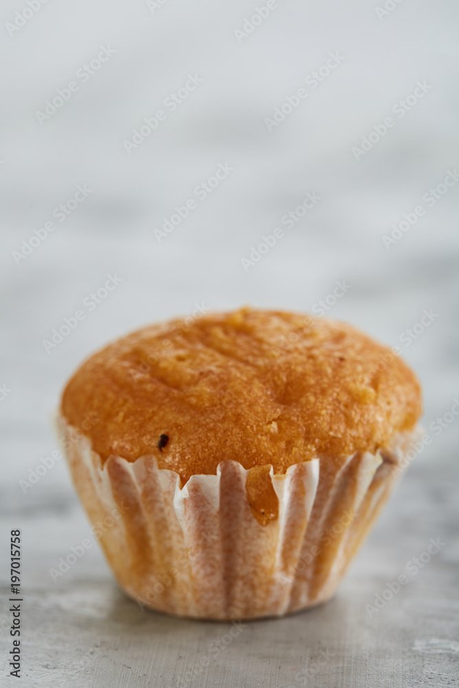 Tasty muffins arranged in pattern on light textured background, close-up, shallow depth of field, selective focus. Tasty muffins arranged in pattern on light textured background, close-up, shallow depth of field, selective focus.