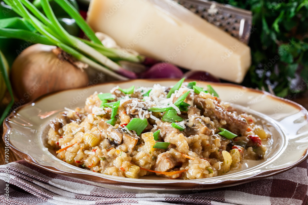 Risotto with champignon mushrooms, pork and parmesan Risotto with champignon mushrooms, pork and parmesan