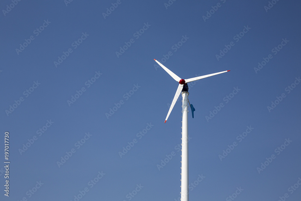 Wind turbine electric, Wind energy turbine, Blue sky. Wind turbine electric, Wind energy turbine, Blue sky.