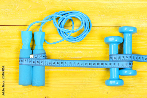 Sports equipment in cyan blue color. Centimeter tied around sports