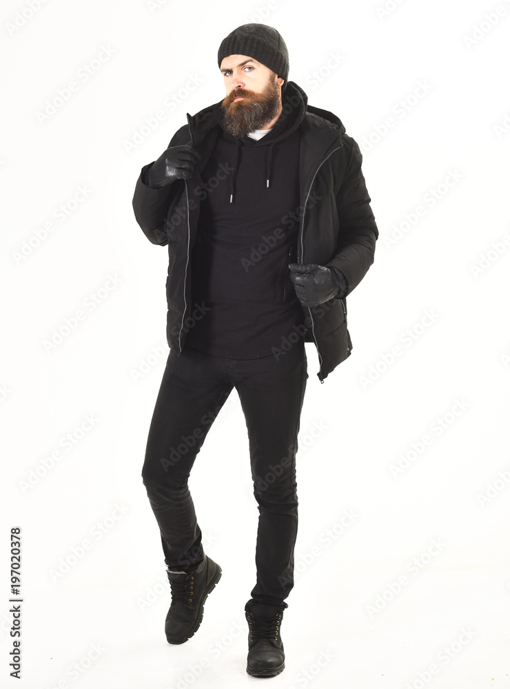 Macho with beard and mustache wears winter coat and hat. Macho with beard and mustache wears winter coat and hat.