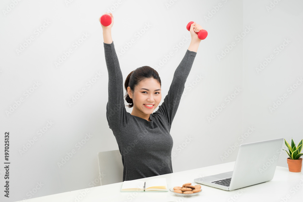 Business woman working and workout at her office Business woman working and workout at her office