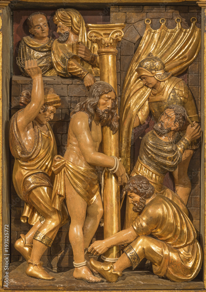 ZARAGOZA, SPAIN - MARCH 3, 2018: The polychome carved renaissance relief of Flagelation of Jeus in church  Iglesia de San Miguel de los Navarros by Damian Forment (1519).