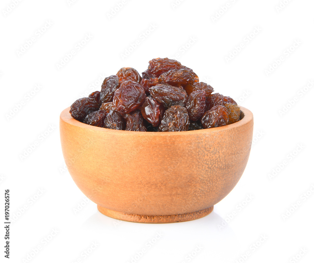 raisin on wood bowl isolated on white background raisin on wood bowl isolated on white background