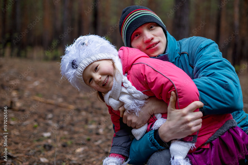 Father and his daughter in autumn forest Father and his daughter in autumn forest