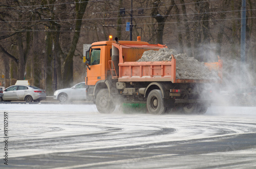 Snow-removal vehicles on the streets.