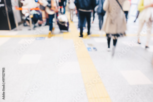 Blurred people in train station movement rush hour