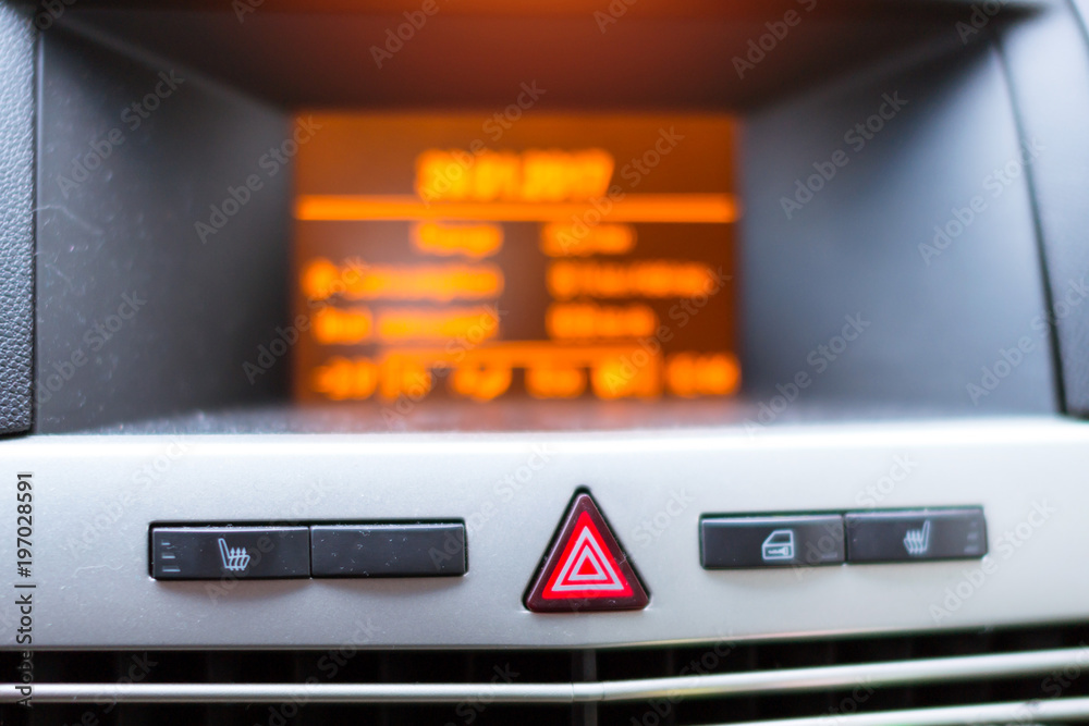 On-Board car computer to help the driver. Modern transport technologies in mechanical engineering. Close-up details of car interior. Accessories for vehicles, Buttons of alarm, heating, central lock On-Board car computer to help the driver. Modern transport technologies in mechanical engineering. Close-up details of car interior. Accessories for vehicles, Buttons of alarm, heating, central lock